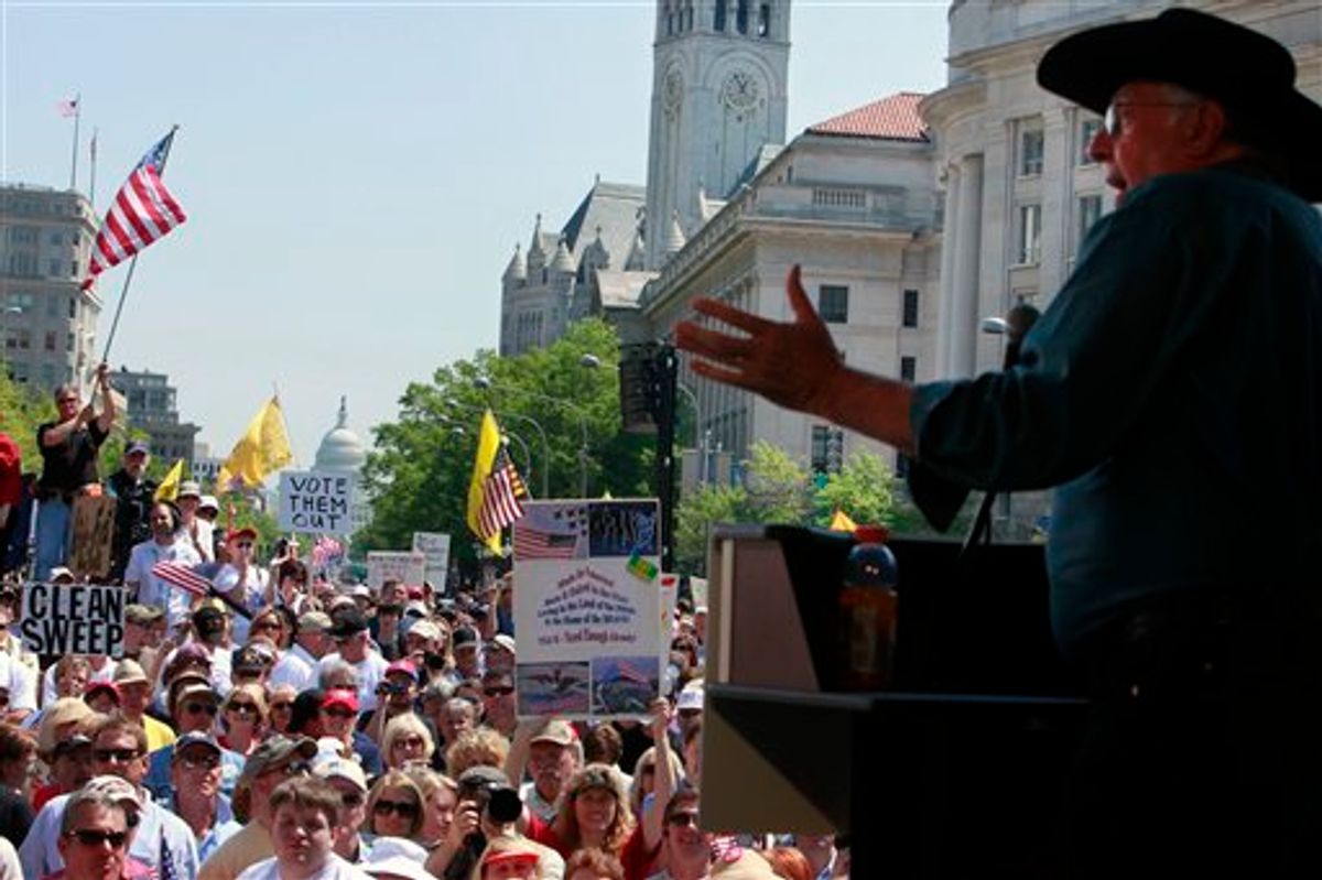 With the Capitol in the background, former House Majority Leader Dick Armey addresses a Tea Party rally at Freedom Plaza in Washington, Thursday, April 15, 2010. (AP Photo/Jacquelyn Martin)   (AP)