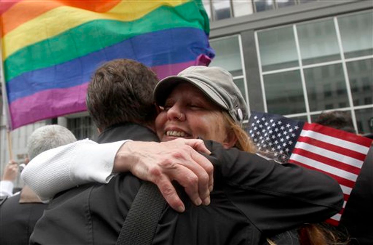 Sheree Red Bornand, right, hugs Aidan Dunn after hearing the decision in the United States District Court proceedings challenging Proposition 8 outside of the Phillip Burton Federal Building in San Francisco, Wednesday, Aug. 4, 2010. A person close to the case says a federal judge has overturned California's same-sex marriage ban in a landmark case that could eventually land before the U.S. Supreme Court. Chief U.S. District Judge Vaughn Walker made his ruling Wednesday in a lawsuit filed by two gay couples who claimed the voter-approved ban violated their civil rights. (AP Photo/Jeff Chiu) (AP)