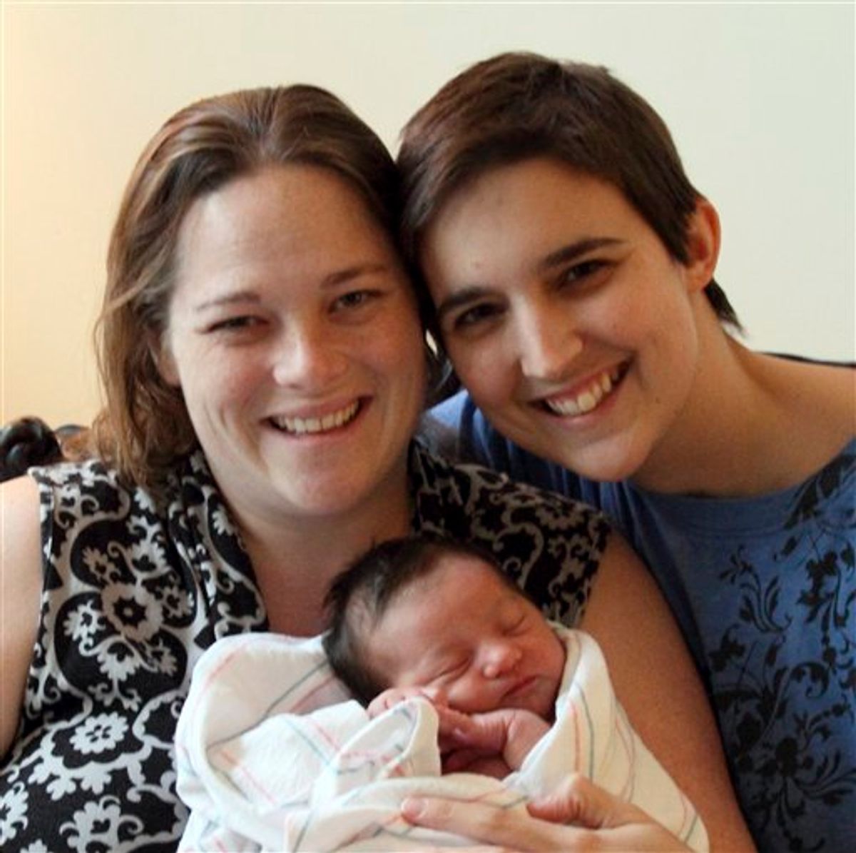 This undated photo provided by Heather Kraft shows, from left to right, Heather, baby Esther Kraft and Kathryn Kraft of Newton, Mass. Heather and Kathryn had a church wedding five years ago in white gowns and 10 bridesmaids after obtaining a marriage license under their state's gay marriage law.  The couple chose to use Kathryn's Kraft as their last name and Heather's Cole as the middle name for the entire family.  (AP Photo/Heather Kraft)   NO SALES  (AP)