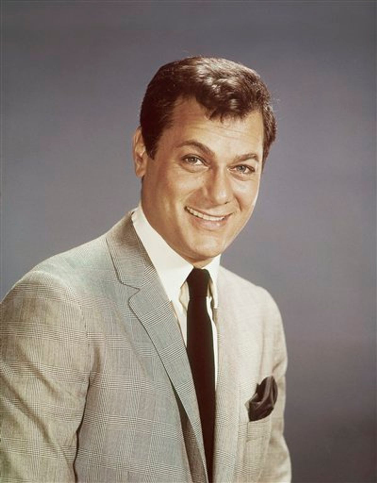 FILE - Actor Tony Curtis is shown in this 1965 file photo. Curtis, whose real name was Bernard Schwartz, was perhaps most known for his comedic turn in Billy Wilder's 'Some Like It Hot' with co-stars Marilyn Monroe and Jack Lemmon has died at 85 according to the Clark County, Nev. coroner. (AP Photo, File)  (AP)