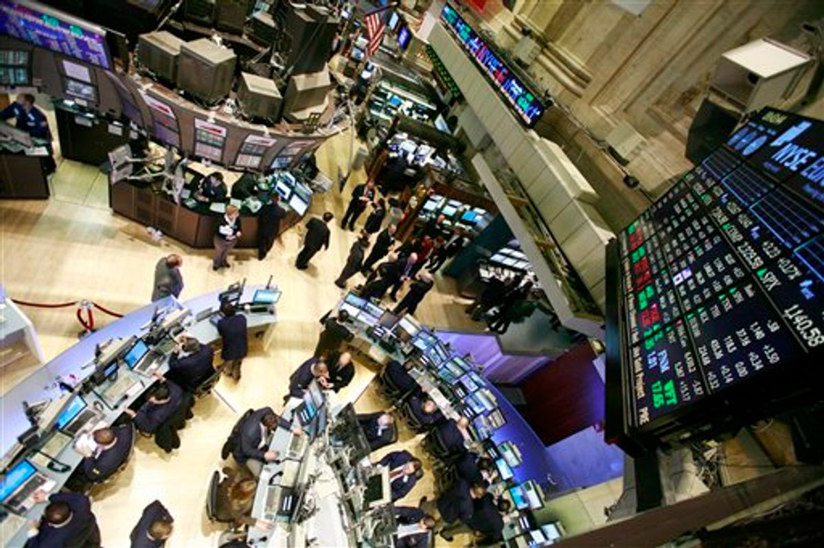 FILE - In this March 8, 2010 file photo, the semi-circular trading desk, lower left, of Cuttone &amp; Co., is seen at the New York Stock Exchange. Stock futures inched lower Tuesday, Sept. 14, 2010, as investors put a rally on hold ahead of a new report on retail sales. (AP Photo/Mark Lennihan, file) (AP)