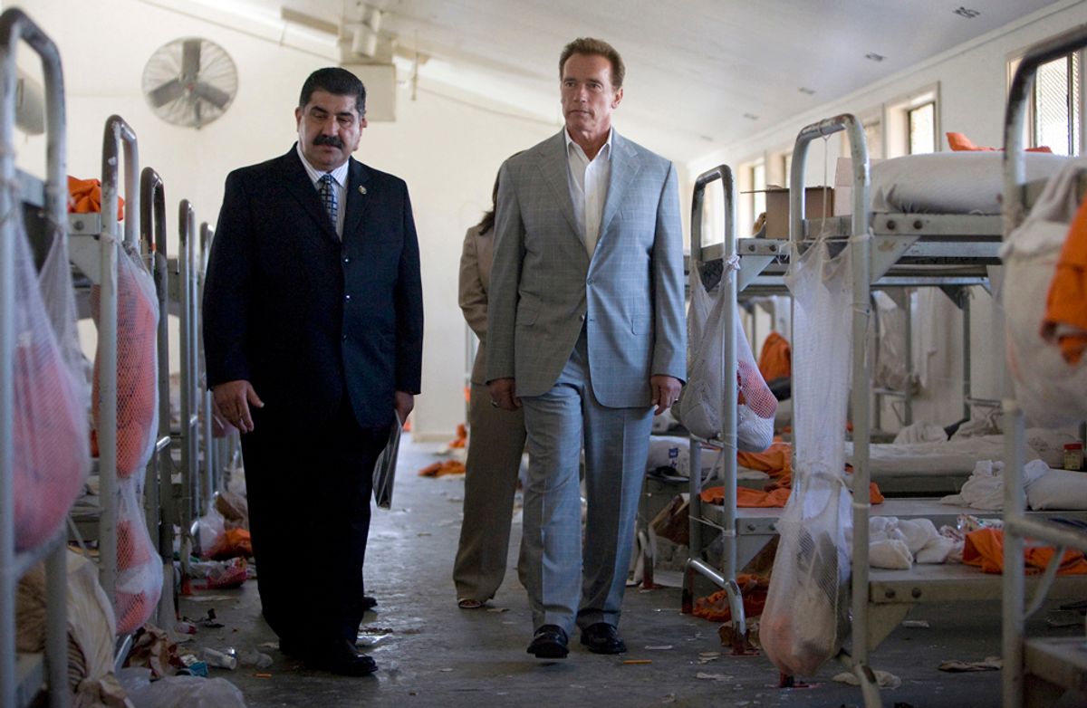 California Governor Arnold Schwarzenegger (R) tours an area at the California Institution for Men with acting Warden Aref Fakhoury  in Chino, California August 19, 2009. A riot occurred at the prison last week as the state deals with a problematic overcrowding of the states prison system.    REUTERS/Office of the Governor/Handout  (UNITED STATES POLITICS CRIME LAW CONFLICT) FOR EDITORIAL USE ONLY. NOT FOR SALE FOR MARKETING OR ADVERTISING CAMPAIGNS  (Â© Ho New / Reuters)