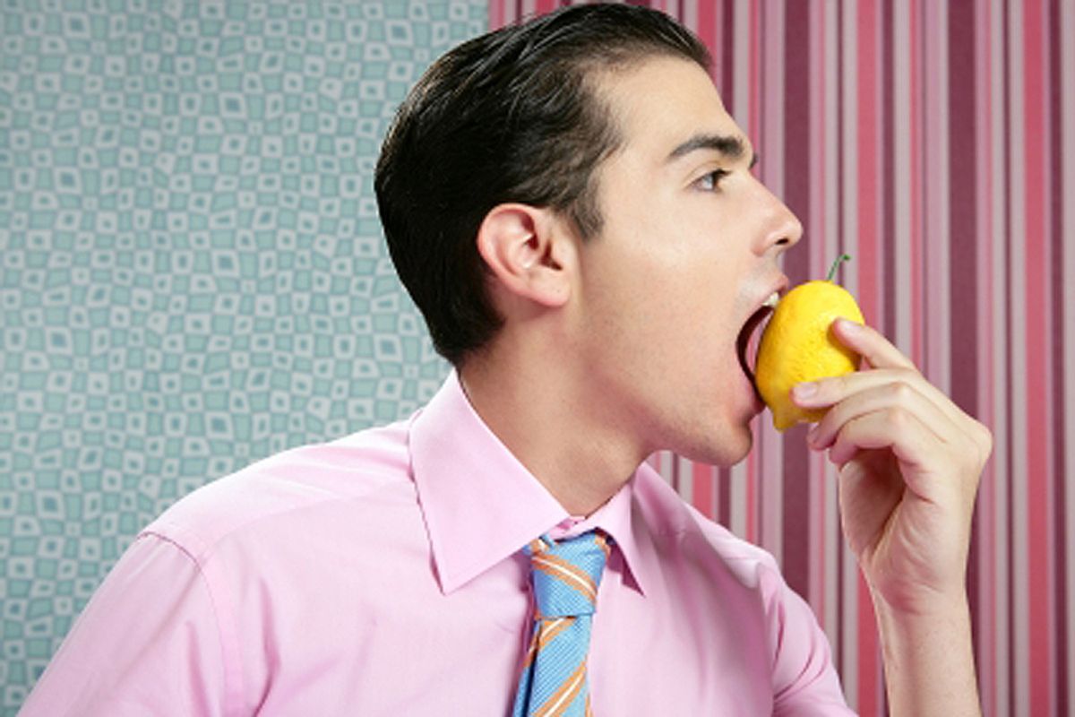 Funny businessman with lemon fruit on his hand in wallpaper background (Tono Balaguer)