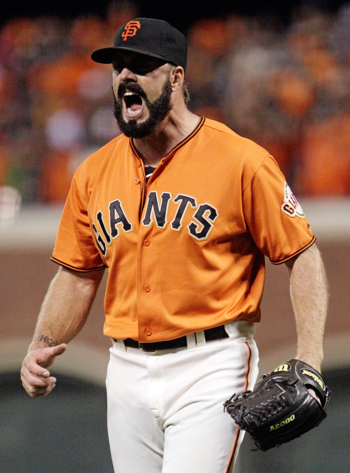 San Francisco Giants relief pitcher Brian Wilson shouts after striking out Atlanta Braves Derrek Lee for the third out in the ninth inning of Game 2 of the National League Division Series baseball game in San Francisco, Friday, Oct. 8, 2010. (AP Photo/Ben Margot) (Ben Margot)