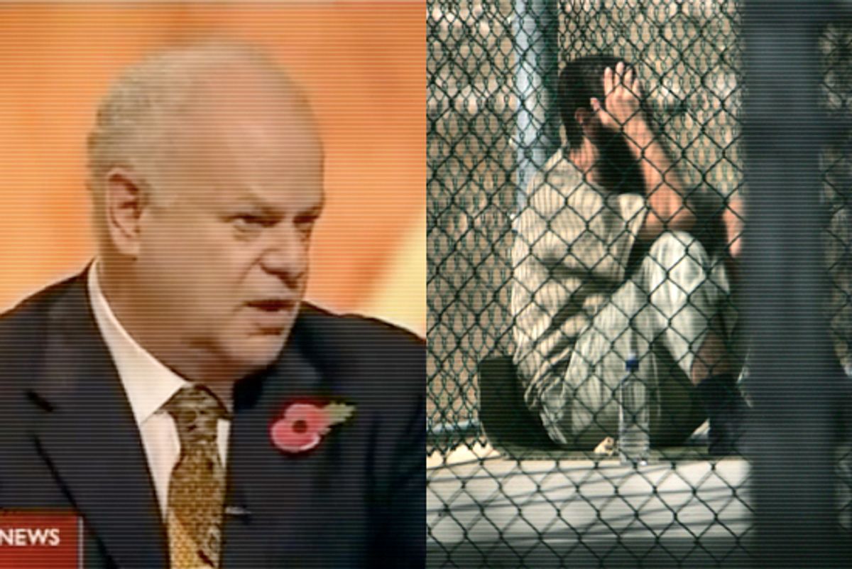 Left: Marty Seligman. A Guantanamo detainee sits alone inside a fenced area during his daily outside period, at Guantanamo Bay U.S. Naval Base, Cuba.

 