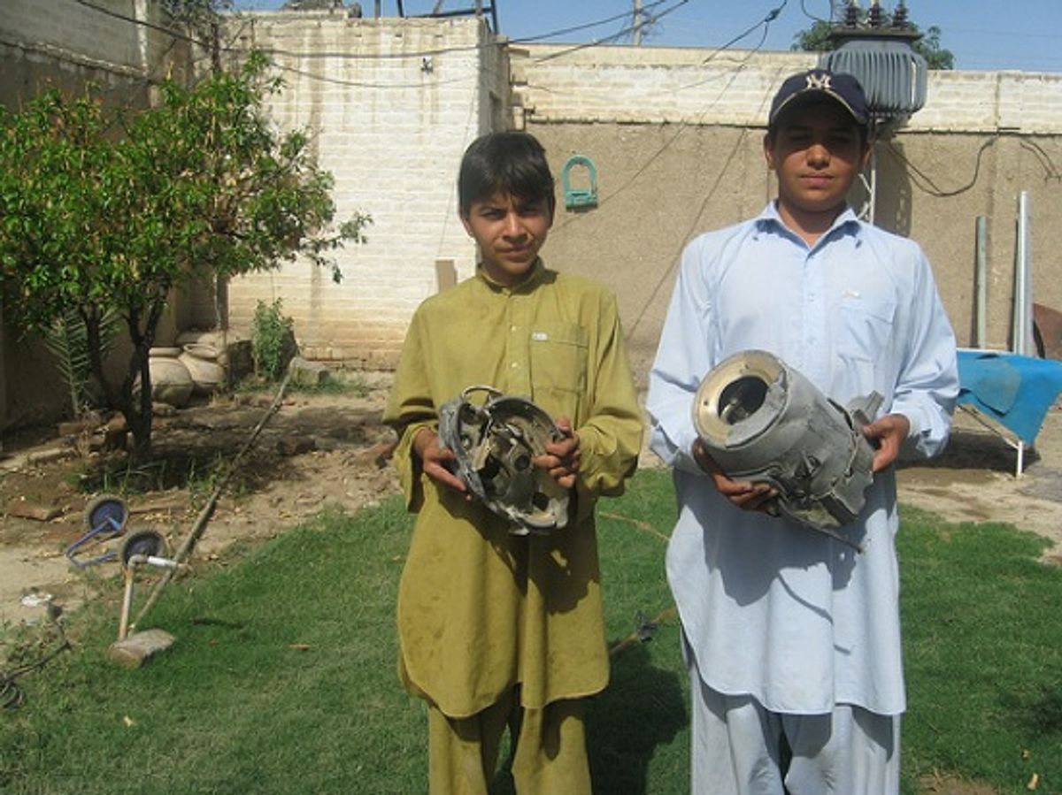 Children in North Waziristan with debris from drone missile