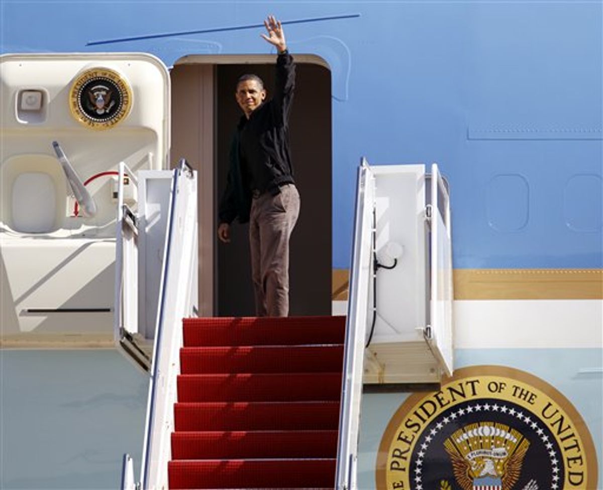 President Barack Obama waves from Air Force One before departing at Andrews Air Force Base, Md. on Sunday, Oct. 17,  2010, on route to  to Ohio for an pre-election rally. (AP Photo/Jose Luis Magana) (AP)