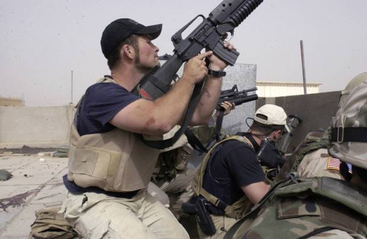 Plainclothes contractors working for Blackwater USA take part in a firefight on Sunday, April 4, 2004 in the Iraqi city of Najaf  