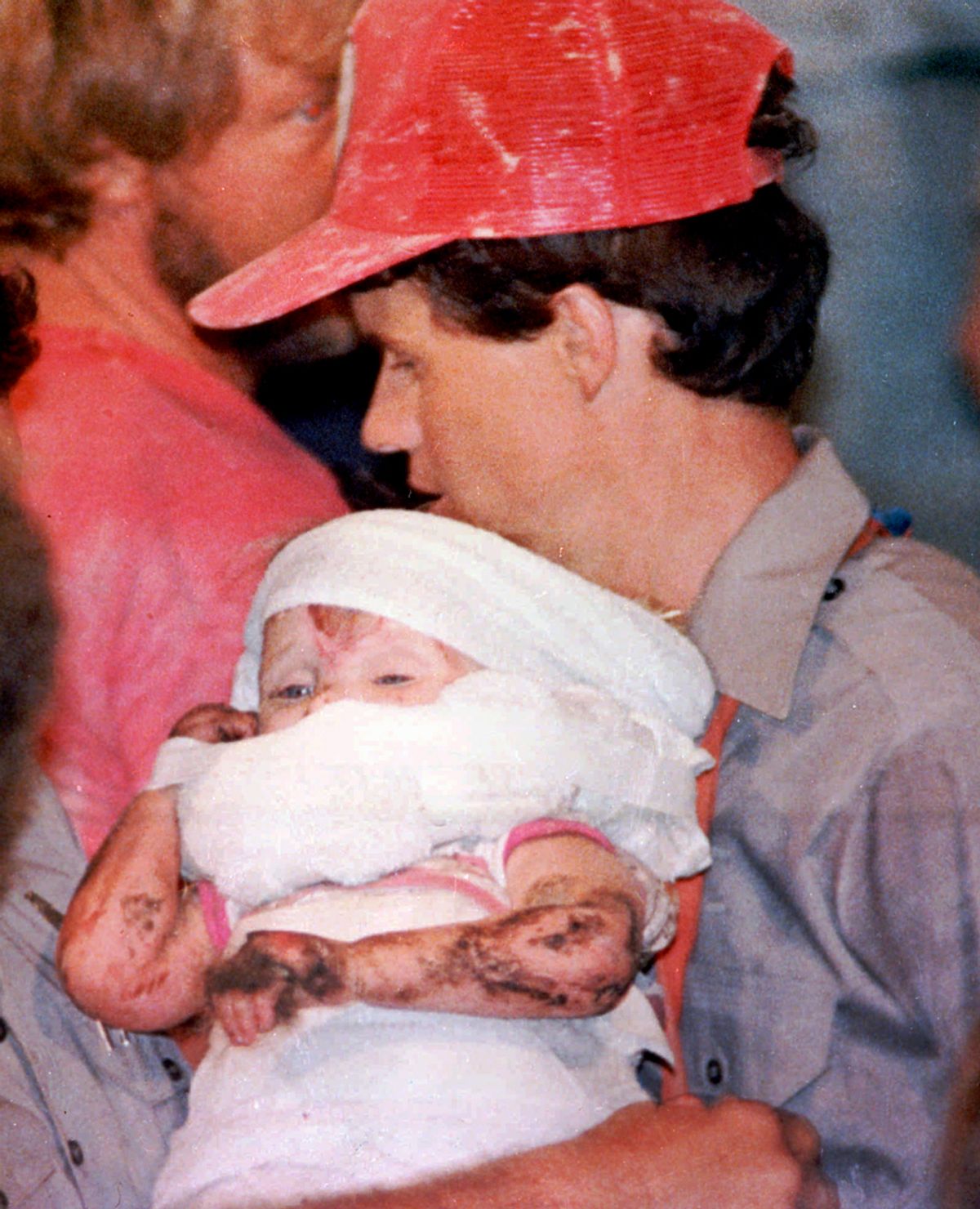 Rescue worker carries 18-month-old Jessica McClure Oct.16,1987, shortly after she was rescued from an abandoned water well at Midland,Texas.