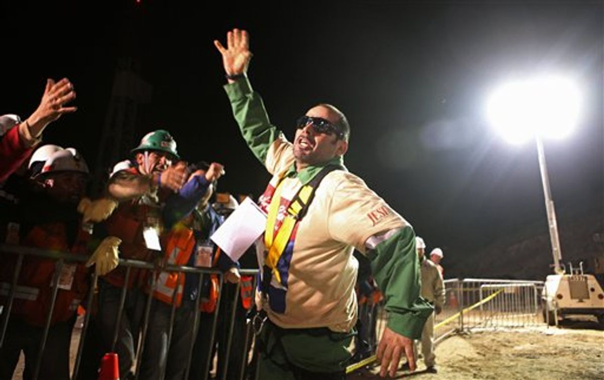 In this photo released by the Chilean government, miner Mario Sepulveda celebrates after being rescued from the collapsed San Jose gold and copper mine where he was trapped with 32 other miners for over two months near Copiapo, Chile, early Wednesday Oct. 13, 2010.  (AP Photo/Hugo Infante, Chilean government) (AP)
