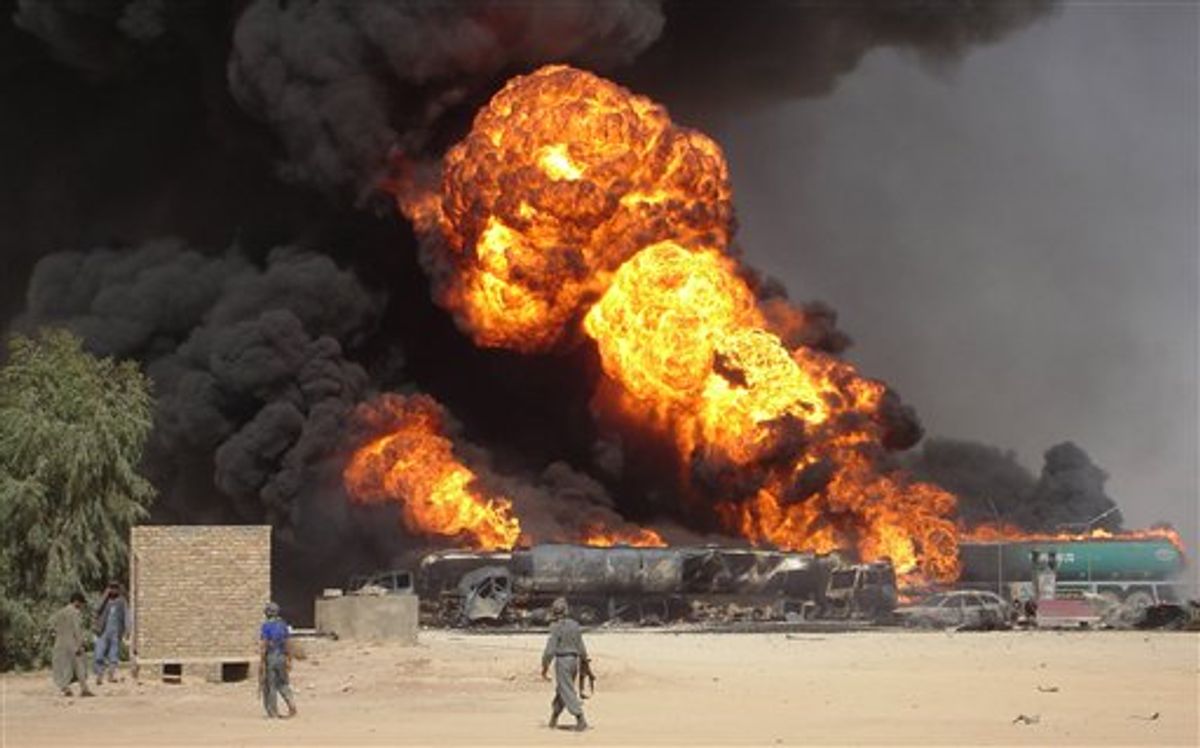 FILE - In this Tuesday, Sept 11, 2007 file picture, plumes of fire and smoke fill the sky after a suicide car bomb explosion which hit fuel tanker trucks on the main highway of Helmand province, south of Kabul, Afghanistan. (AP Photo/Abdul Khaleq, File)  (AP)