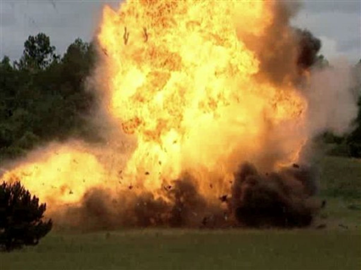 This June 29, 2010 photo taken from video and provided by the Federal Bureau of Investigation shows an FBI-staged explosion in Osceola Mills, Pa., that prosecutors say replicates the power of the car bomb Faisal Shahzad tried to detonate in New York's Times Square on May 1, 2010. Shahzad, who pleaded guilty in June to 10 terrorism and weapons counts, was sentenced Tuesday, Oct. 5 2010 to life in prison. (AP Photo/FBI) (AP)