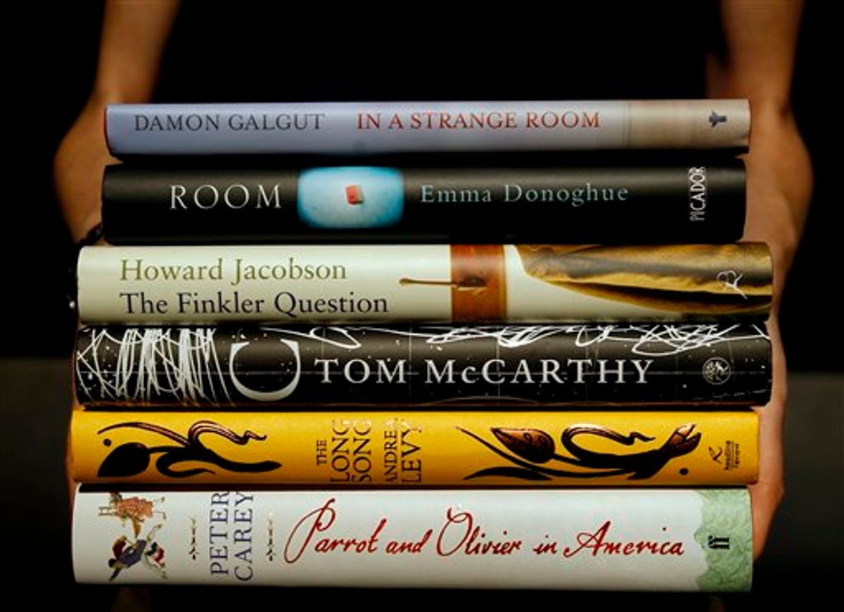 The six books shortlisted for the 2010 Man Booker Prize are held at a photocall on the stage of the Royal Festival Hal in London, Sunday, Oct. 10, 2010. The winner will be announced on Tuesday, Oct. 12 at a dinner at London's Guildhall. (AP Photo/Kirsty Wigglesworth) (AP)