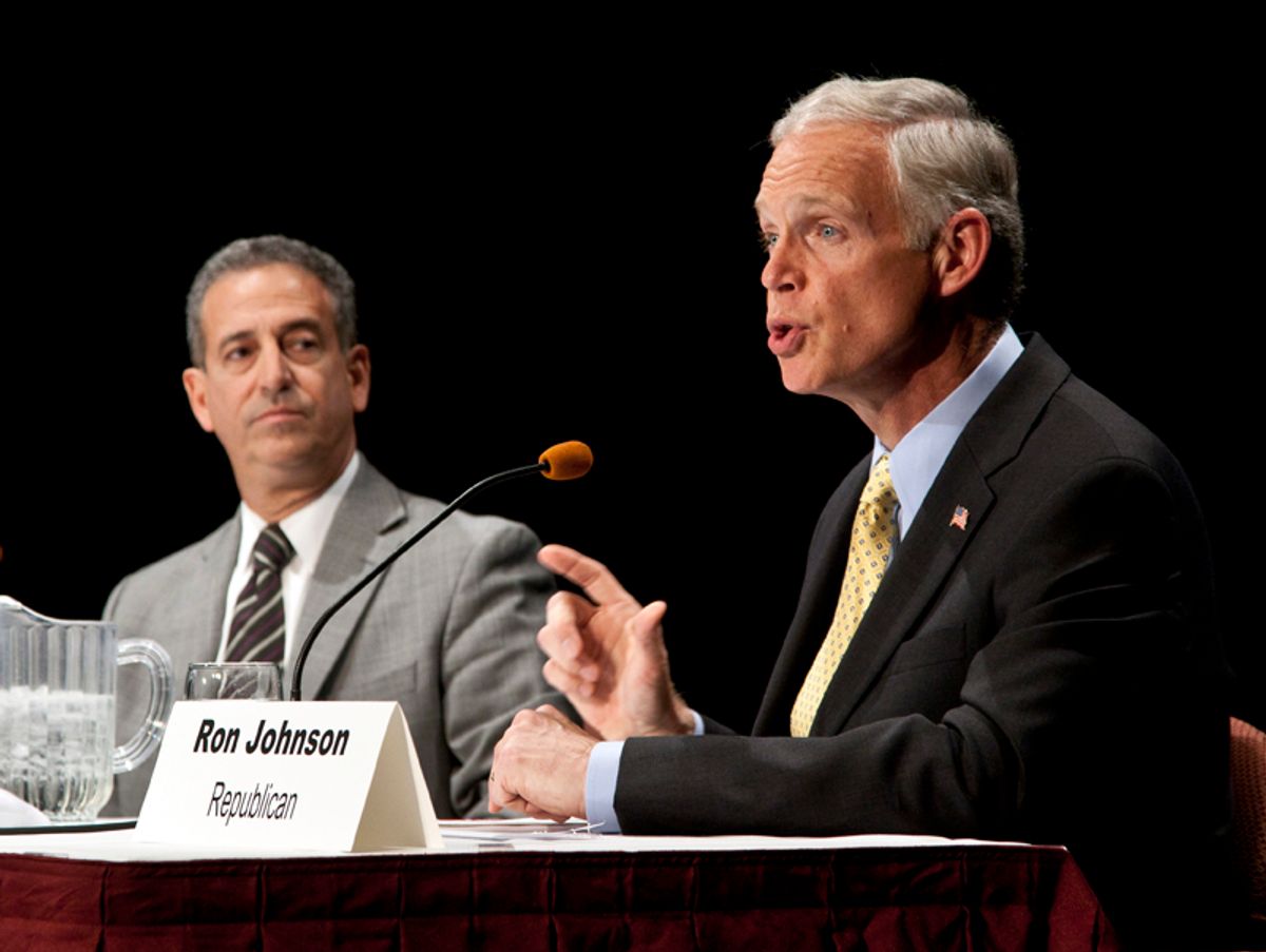 Wisconsin senatorial candidates Democrat Sen. Russ Feingold, left, and Republican Ron Johnson participate in a debate Monday, Oct. 11, 2010, in Wausau, Wis. (AP Photo/Morry Gash)             (Morry Gash)