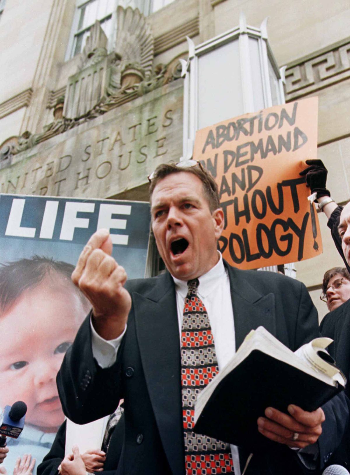 Rev. Flip Benham, national director of Operation Rescue, condemns the U.S. Federal Court ruling regarding abortion clinics, on the steps of the U.S, courthouse in Buffalo, New York April 18 as he  prepares for a week of "Operation Save America."  The October shooting of Dr. Barnett Slepian, a Buffalo abortion doctor, has brought out both sides for protests at women's health clinics. (Â© Joe Traver / Reuters)