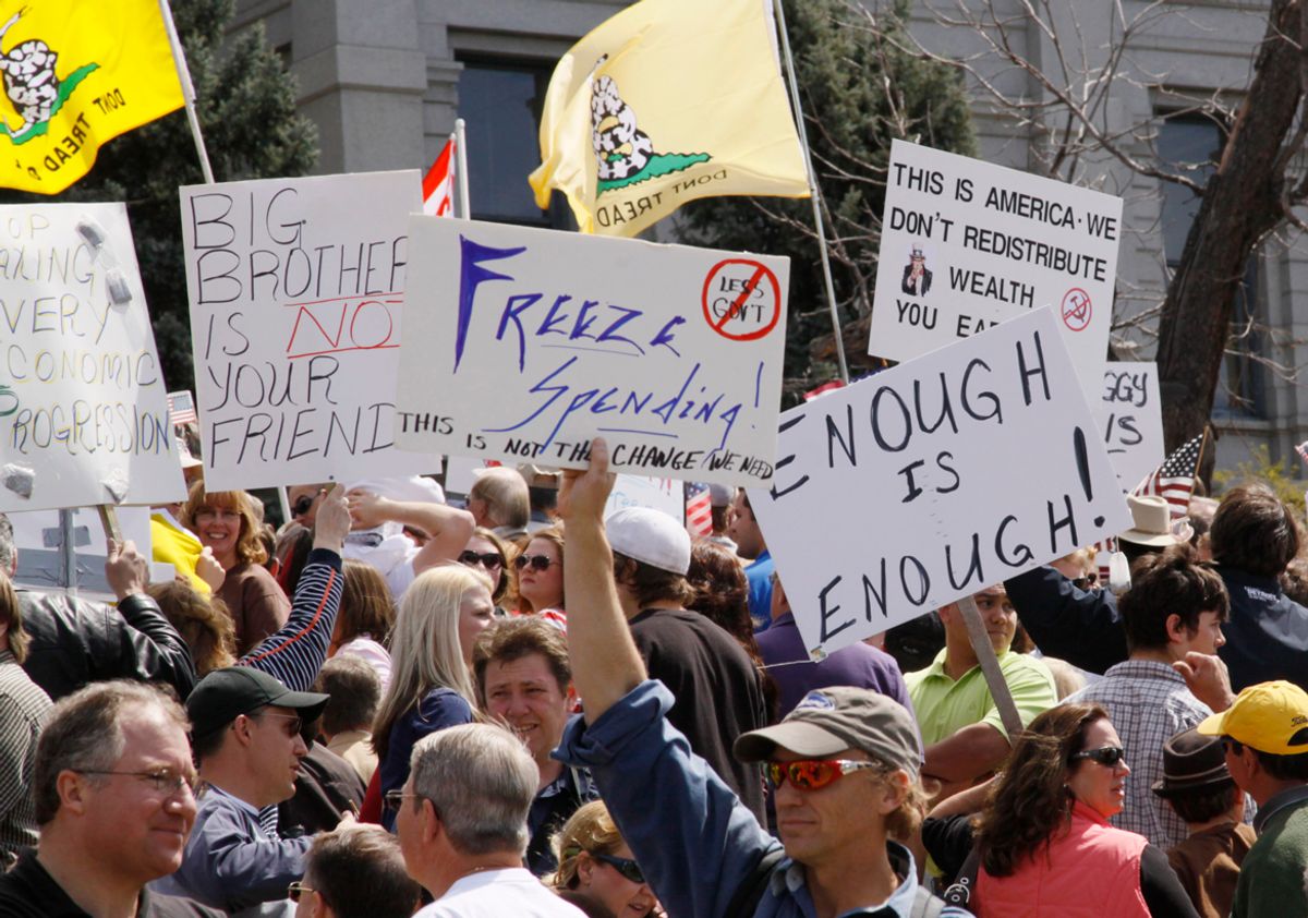 People wave signs at a "tea party" protest on the grounds of the Colorado tate capitol in Denver April 15, 2009. Protests were held in many U.S. cities loosely inspired by the 1773 Boston Tea Party rebellion against British colonial taxes, which helped spark the American revolution. The crowds demonstrated against taxes, government bailouts and U.S. President Barack Obama's budget proposal. REUTERS/Rick Wilking (UNITED STATES POLITICS CONFLICT BUSINESS) (Â© Rick Wilking / Reuters)