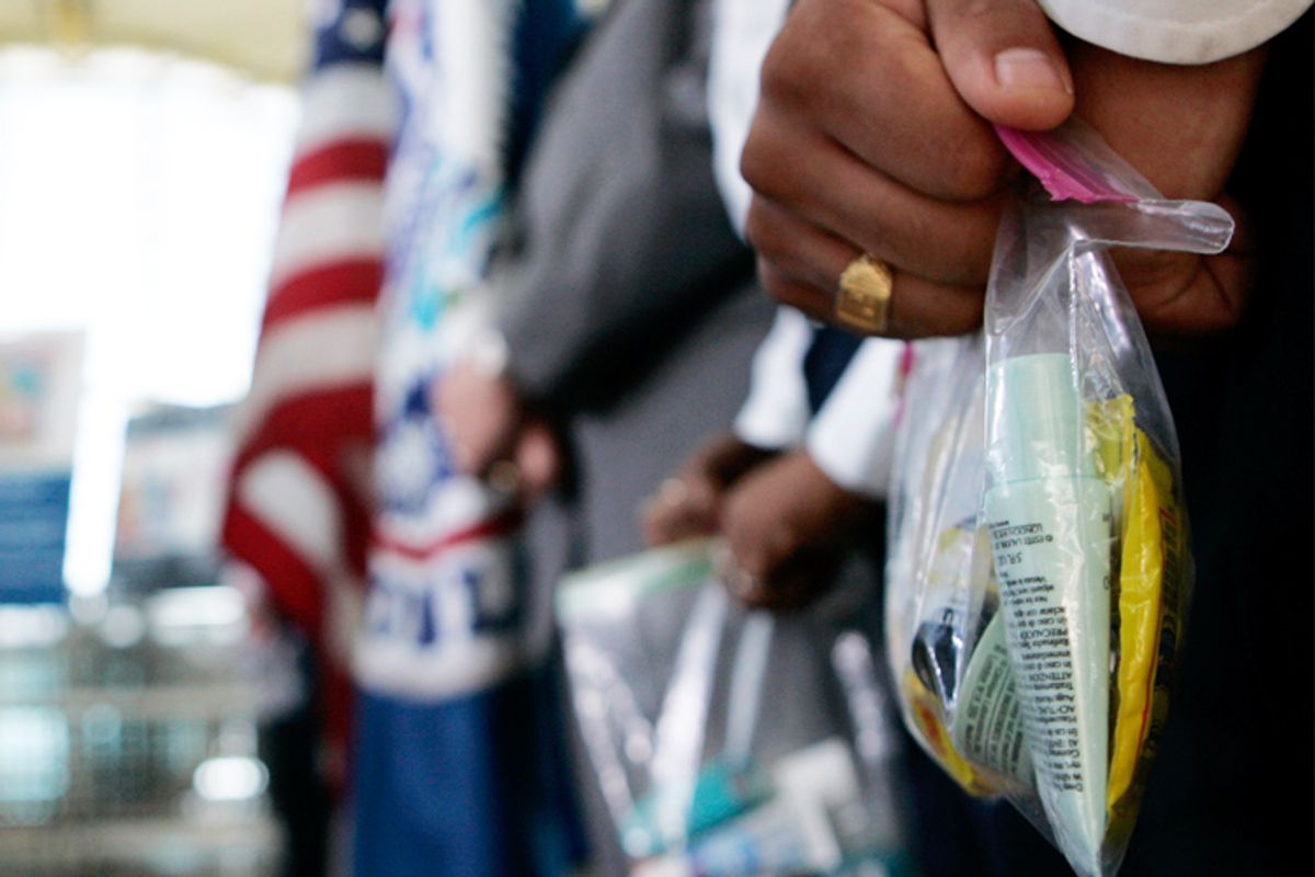 A TSA official holds a bag of liquids and gels at Washington's Reagan National Airport.