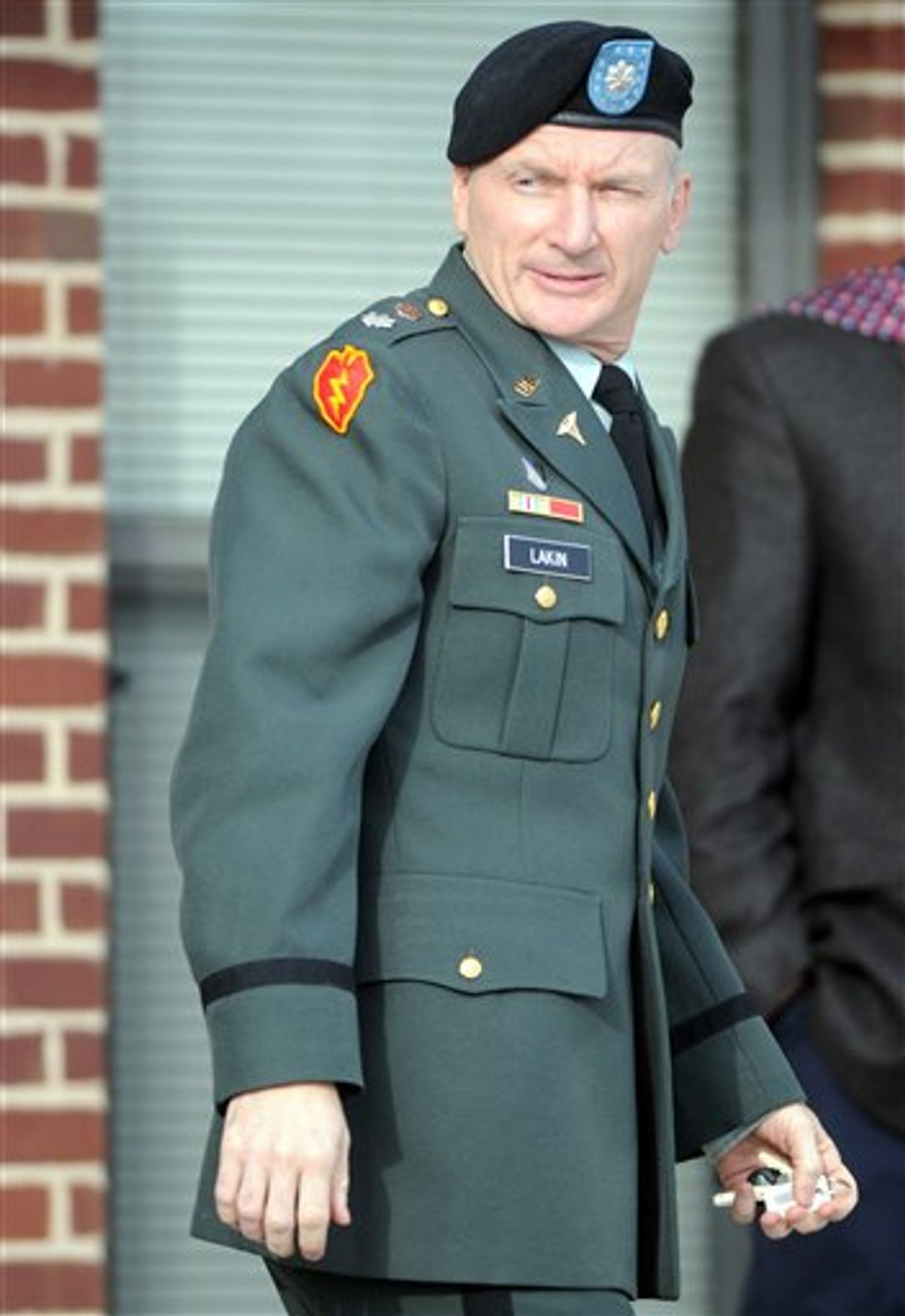 Army Lt. Col. Terrence Lakin of Greeley, Colo. leaves a military court during a break in his court-martial proceeding Tuesday, Dec. 14, 2010 at Fort Meade, Md. Lakin is being tried for allegedly refusing to deploy to Afghanistan because he does not believe that President Barack Obama was born in the United States and therefore questions his eligibility to be commander in chief. (AP Photo/Steve Ruark) (AP)
