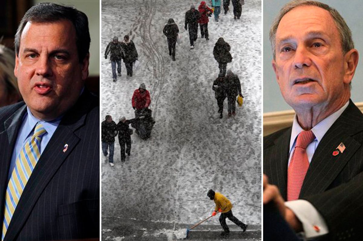 New Jersey Gov. Chris Christie and New York Mayor Michael Bloomberg. Center: A maintenance worker clears snow from the sidewalk in New York's Times Square, Sunday, Dec. 26, 2010. 