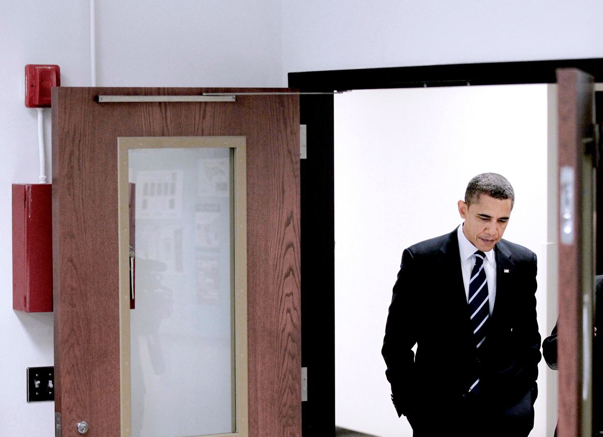 President Barack Obama is seen walking the hallways during his tour the Bio-technology program at Forsyth Tech Community College in Winston-Salem, N.C., Monday, Dec. 6, 2010. (AP Photo/Pablo Martinez Monsivais) (AP)