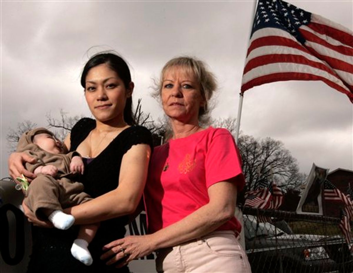 FILE - This March 6, 2009 file photo shows Hotaru Nakama, center, her son, Mickey, and her mother-in-law, Robin Ferschke, right, outside their home in Maryville, Tenn. Nakama married Ferschke's son, Sgt. Michael Ferschke, by phone in 2008 while he was stationed in Iraq and she was in Japan. Sgt. Ferschke died in combat a month later. The House on Wednesday Dec. 15, 2010, approved a private relief bill, meaning it only applies to an individual case, granting permanent resident status to Hotaru Ferschke. (AP Photo/Wade Payne, File) (AP)