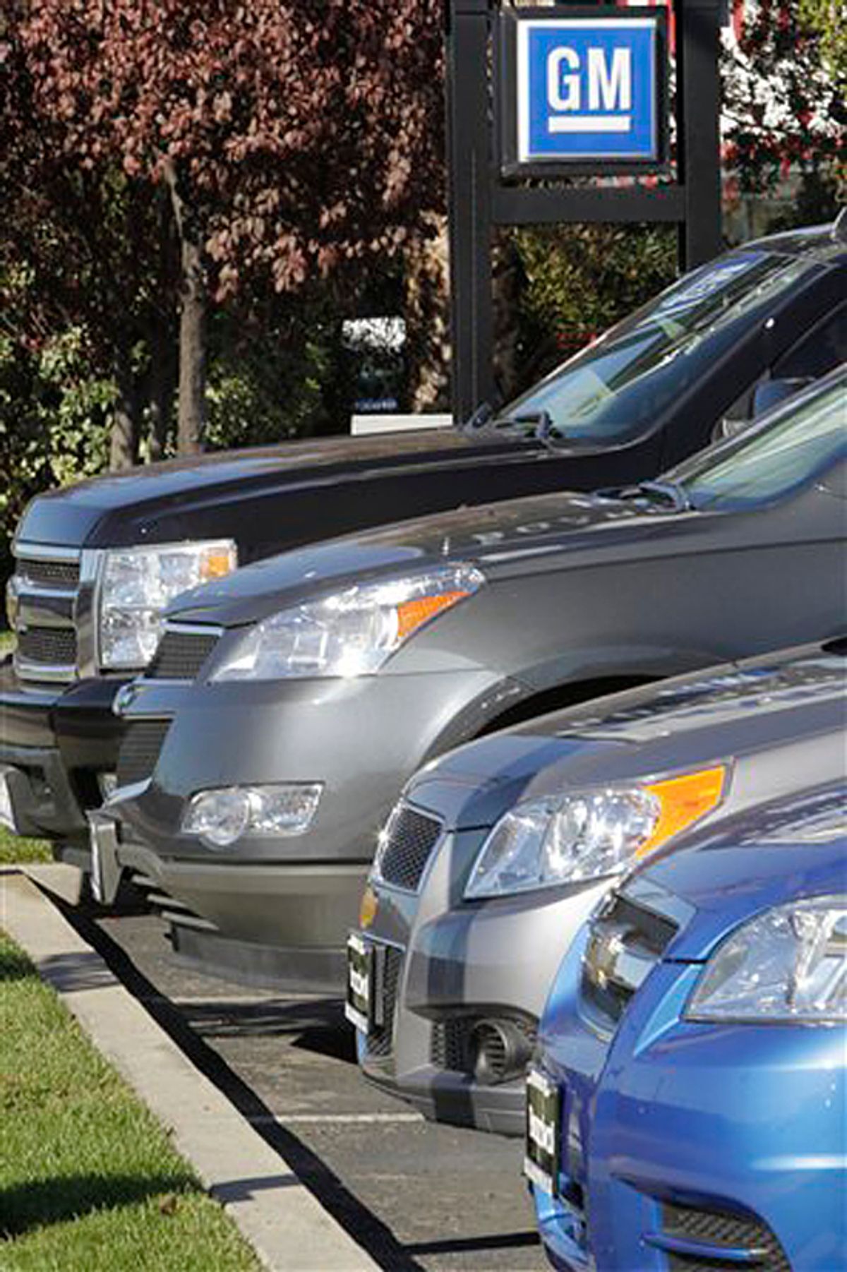 In this Nov. 29, 2010 photo, a row of GM vehicles are displayed at a GM dealership in Redwood City, Calif. Sales of General Motors cars and trucks rose 11 percent last month, a sign that the auto industry's slow recovery is gaining traction.(AP Photo/Paul Sakuma) (Paul Sakuma)