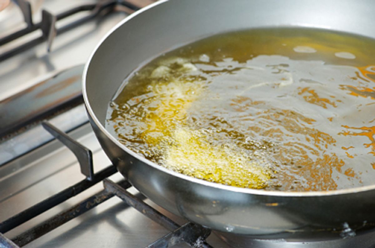 frying pan on gas hob with frying oil