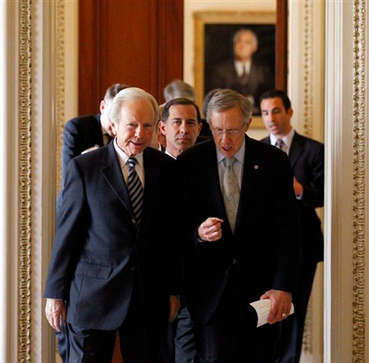 Sen. Joe Lieberman, I-Conn., left, and Senate Majority Leader Sen. Harry Reid, D-Nev., right, with Joe Solmonese, president of the Human Rights Campaign, center, head to a news conference about the "Don't Ask Don't Tell" bill on an unusual Saturday session on Capitol Hill in Washington Saturday, Dec. 18, 2010.  Repeal would mean that, for the first time in American history, gays would be openly accepted by the military. Reid said a final vote would come at 3 p.m. (AP Photo/Alex Brandon) (AP)