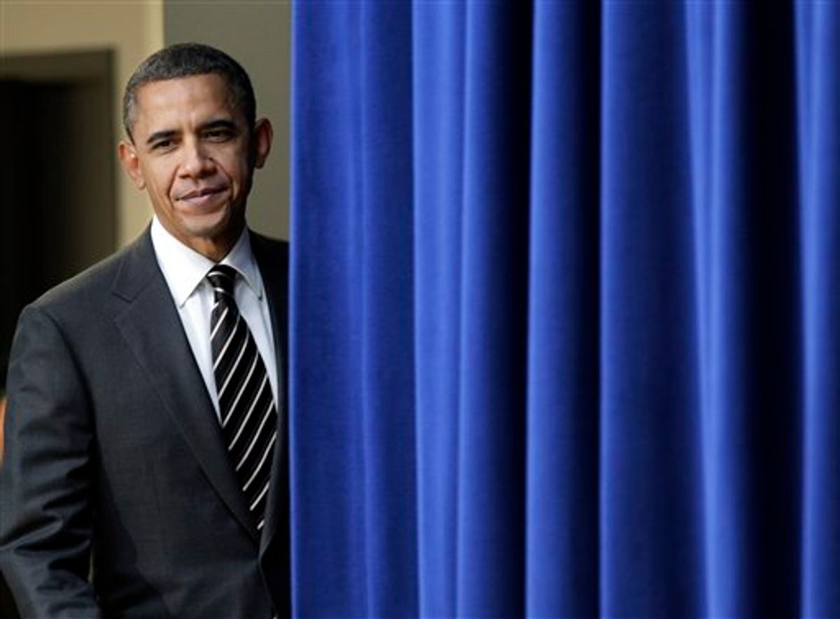 President Barack Obama pauses at the stage curtain as he arrives to sign the Claims Resolution Act of 2010 which settles long-standing lawsuits by African American farmers and Native Americans against the federal government, in the Eisenhower Executive Office Building, part of the White House complex, in Washington, Wednesday, Dec. 8, 2010. The act also authorizes $1.15 billion for black farmers who say they were discriminated against by the U.S. Department of Agriculture. (AP Photo/J. Scott Applewhite) (AP)