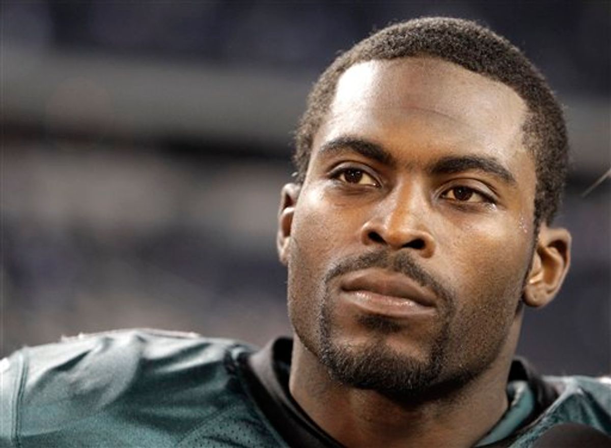 FILE - This Dec. 12, 2010, file photo shows Philadelphia Eagles quarterback Michael Vick after an NFL football game against the Dallas Cowboys,  in Arlington, Texas. The convicted dogfighting-ring operator tells TheGrio.com in a video interview that he genuinely cares for animals and one day hopes to have a dog as a household pet. Vick says it would a "big step" in his rehabilitation process.(AP Photo/LM Otero, File)  (AP)