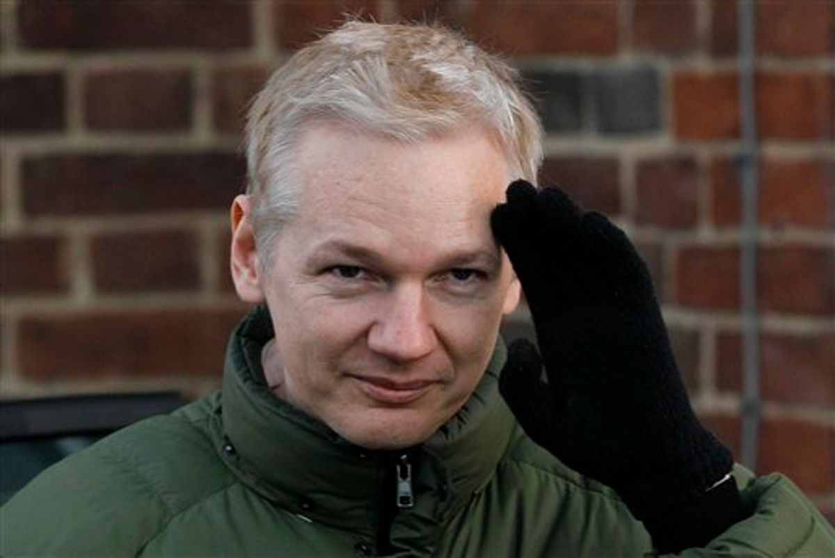 Julian Assange head of WikiLeaks gestures as he gets back into a car at Beccles Police Station in Suffolk, England, Friday, Dec. 17, 2010 after complying with bail conditions. Assange said he feared that the United States is getting ready to indict him, saying Friday that he believed that a grand jury was meeting to consider charges against him. He has repeatedly voiced concerns that American authorities were getting ready to press charges over WikiLeaks' release of some 250,000 secret State Department cables, which have angered and embarrassed officials in Washington. (AP Photo/Kirsty Wigglesworth) (AP)