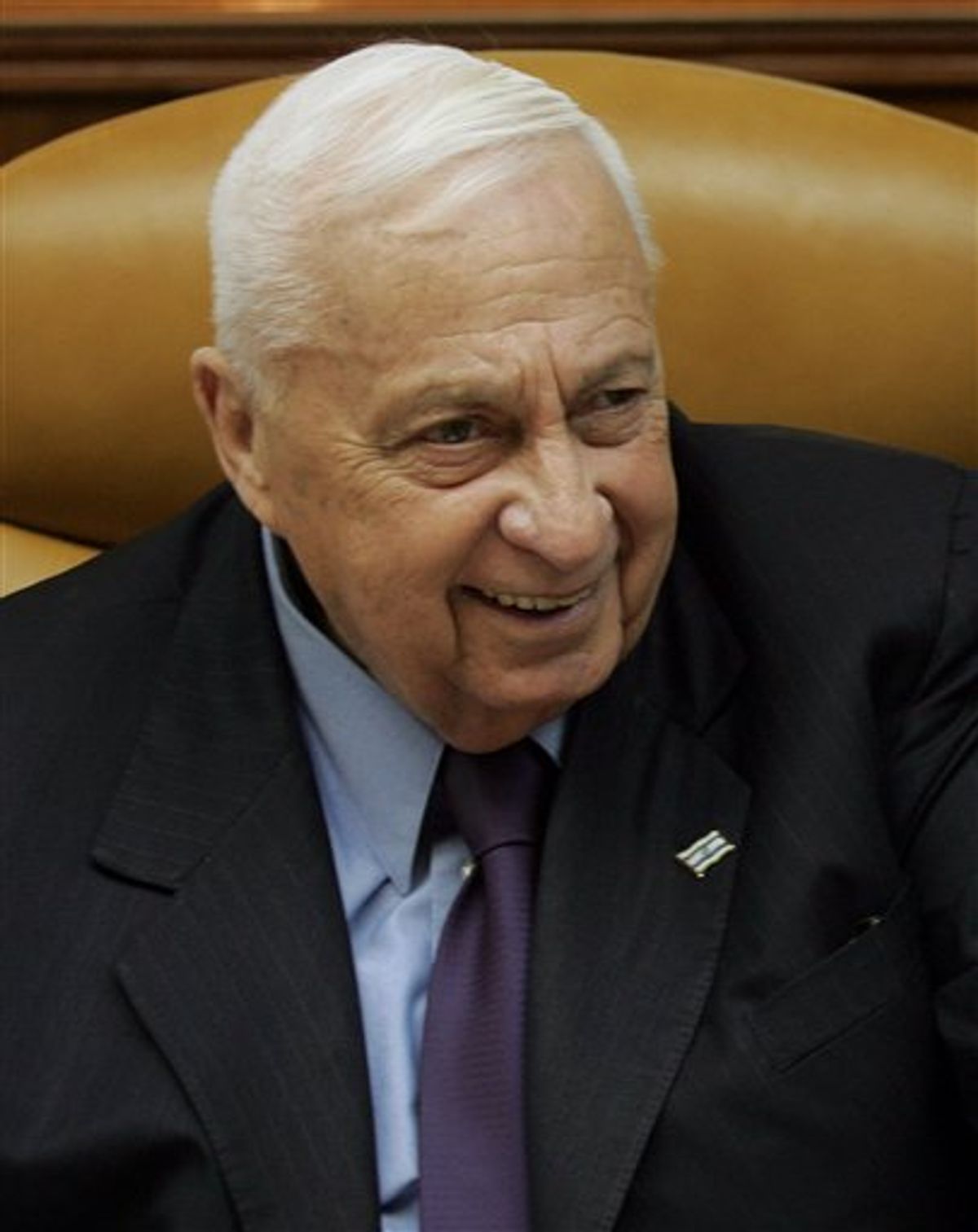 FILE - In This file photo taken Sunday Dec. 18, 2005, Israeli Prime Minister Ariel Sharon smiles as he talks to journalists prior to the weekly cabinet meeting in Jerusalem. Sharon's former aide said on Thursday, Nov. 11, 2010, that the comatose ex-Israeli premier will be moved to his ranch in Israel's south.  Sharon, one of Israel's most popular and controversial figures, has been in the long-term care unit of Tel Hashomer Hospital outside Tel Aviv since suffering a series of strokes in 2006. (AP Photo/ Emilio Morenatti, File) (AP)