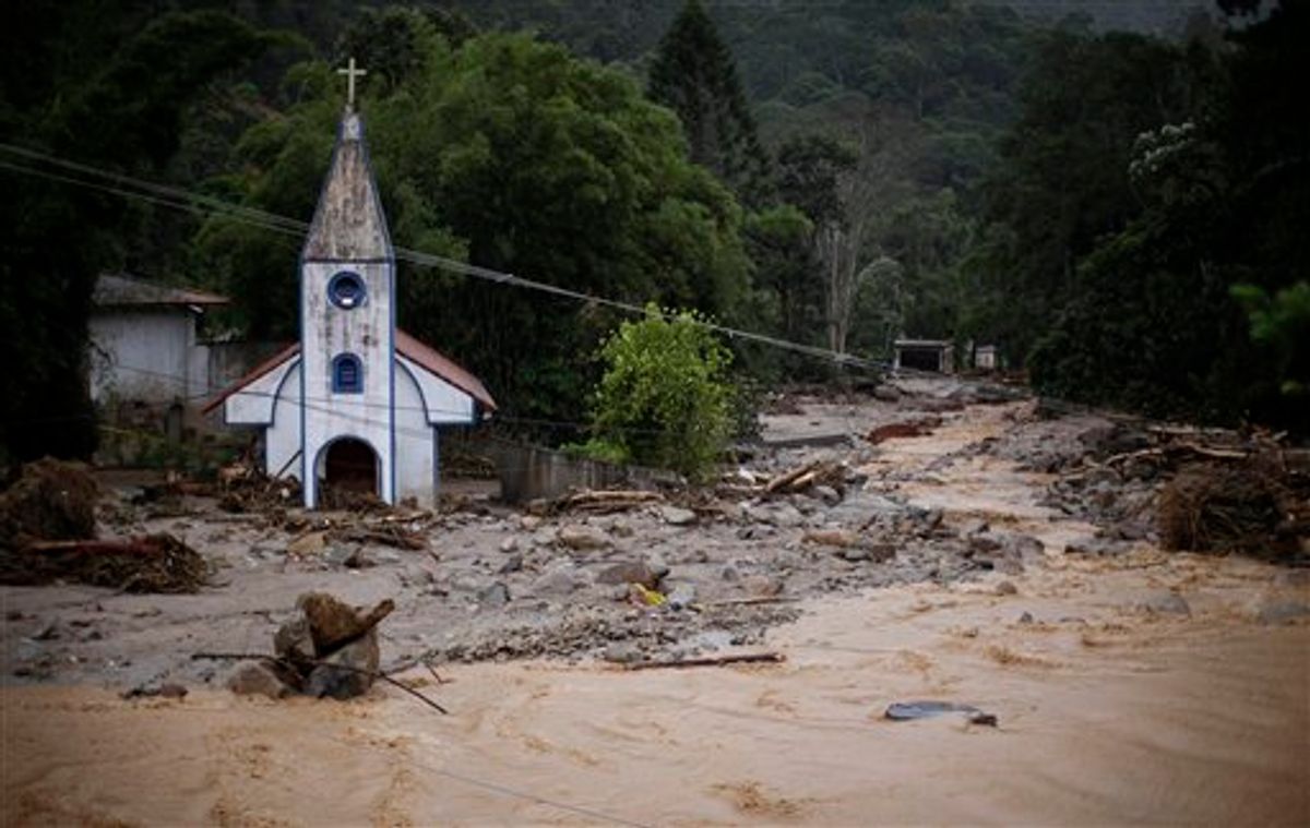 A destroyed church stands surrounded by debris and floodwaters after a landslide in Teresopolis, Rio de Janeiro state, Brazil, Thursday Jan. 13, 2011. At least 350 people have died after landslides hit early Wednesday, and 50 or more were still missing, according to officials.  (AP Photo/Felipe Dana) (AP)