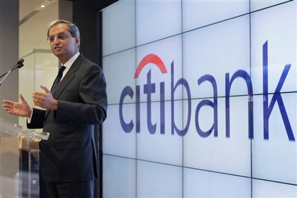 FILE - In this file photo taken Dec. 16, 2010, Citigroup CEO Vikram Pandit speaks during Citibank's new high-tech banking center opening in New York's Union Square. Citigroup has reported fourth-quarter earnings of $1.31 billion Tuesday, Jan. 18, 2011, or 4 cents a share, after losses from its loans declined and the bank was able to dip into the reserves it keeps aside for bad loans. (AP Photo/Mary Altaffer, file) (AP)