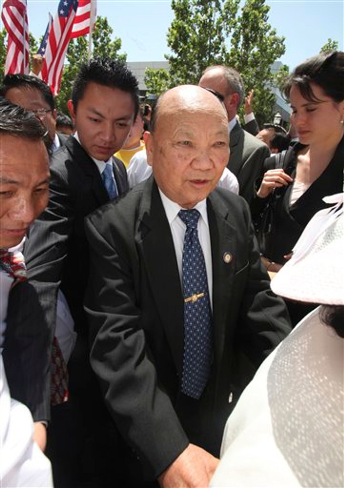 FILE - In this May 11, 2009 file photo, Former Laotian General Vang Pao, center, is escorted by supporters to the federal courthouse, in Sacramento, Calif.  Pao, a former general in the Royal Army of Laos who led thousands of Hmong mercenaries in a CIA backed secret army during the Vietnam War, has died. He was 81.  Pao died Thursday, Jan. 6, 2011, after being hospitalized for about 10 days, said Michelle Von Tersch, a spokeswoman for Clovis Community Medical Center. (AP Photo/Rich Pedroncelli, File)    (AP)