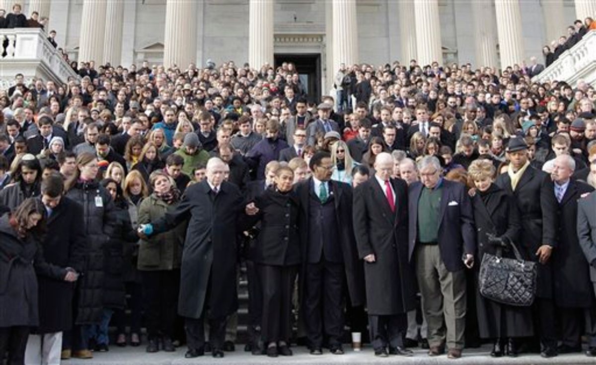 Members of Congress and staff members observe a moment of silence for Rep. Gabrielle Giffords, D-Ariz., and other shooting victims, Monday, Jan. 10, 2011, on the East Steps of the Capitol on Capitol Hill in Washington. Giffords was shot Saturday in a Tucson shooting rampage that left six people dead. Pictured from ninth left to right: Wilson Livingood, Sergeant at Arms, U.S. House of Representatives; Del. Eleanor Holmes Norton, D-D.C.; Rep. Emanuel Cleaver, D-Mo.; Steve Lawrence, chief of staff to House Minority Leader Nancy Pelosi of Calif.; Barry Jackson chief of staff to House Speaker John Boehner of Ohio; Del. Madeleine Bordallo, D-Guam; Rep. Hank Johnson, D-Ga.; and Senate Sergeant at Arms Terry Gainer. (AP Photo/Charles Dharapak) (AP)