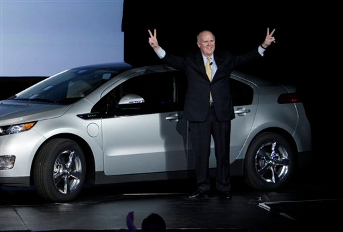 General Motors chief executive officer Dan Akerson raises his arms next to the Chevrolet Volt with the first vehicle identification number at the General Motors Hamtramck assembly plant in Hamtramck, Mich., Tuesday, Nov. 30, 2010. (AP Photo/Paul Sancya) (AP)