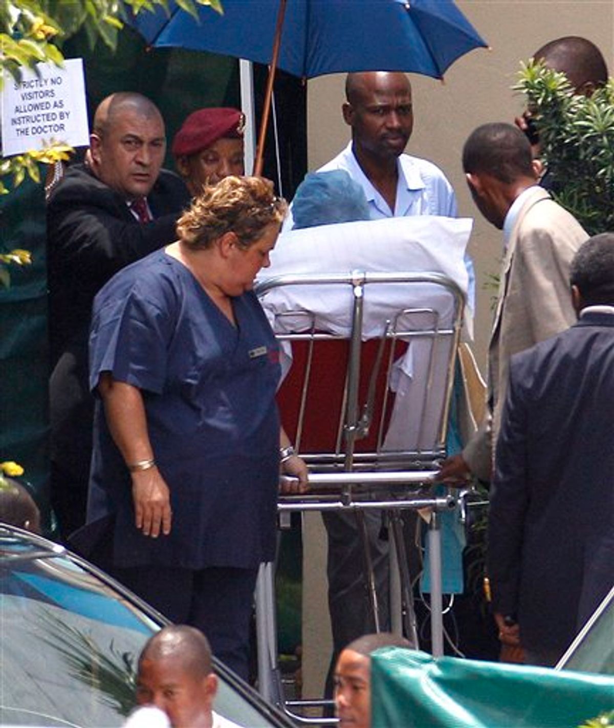 Former South African  President Nelson Mandela is wheeled out on a stretcher, as he leaves the Milpark Hospital in Johannesburg, South Africa, Friday, Jan. 28, 2011. Mandela was discharged to begin home-based care, after spending two-and-a-half days in hospital for treatment for a respiratory infection. (AP Photo/Themba Hadebe)      (AP)