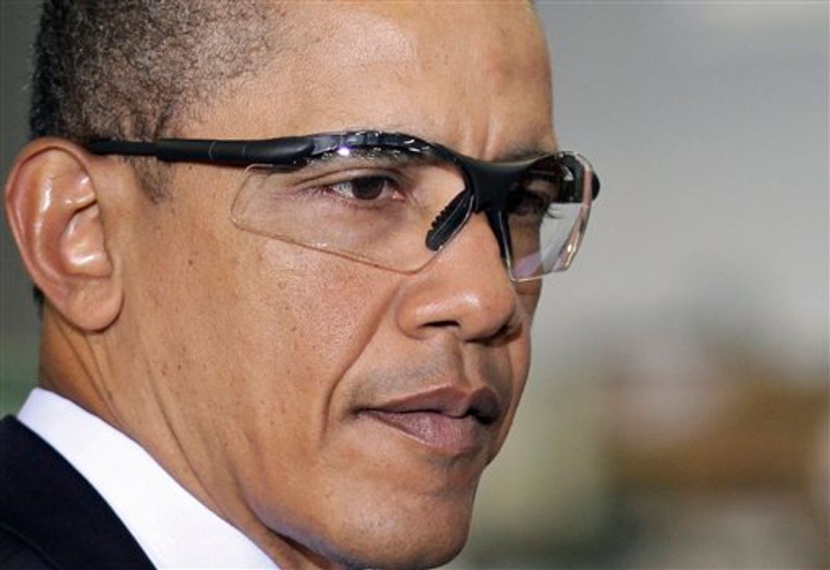 President Barack Obama wears safety glasses during a tour of the Thompson Creek Window Company, where he spoke on the economy, in Landover, Md., Friday, Jan. 7, 2011. (AP Photo/J. Scott Applewhite) (AP)