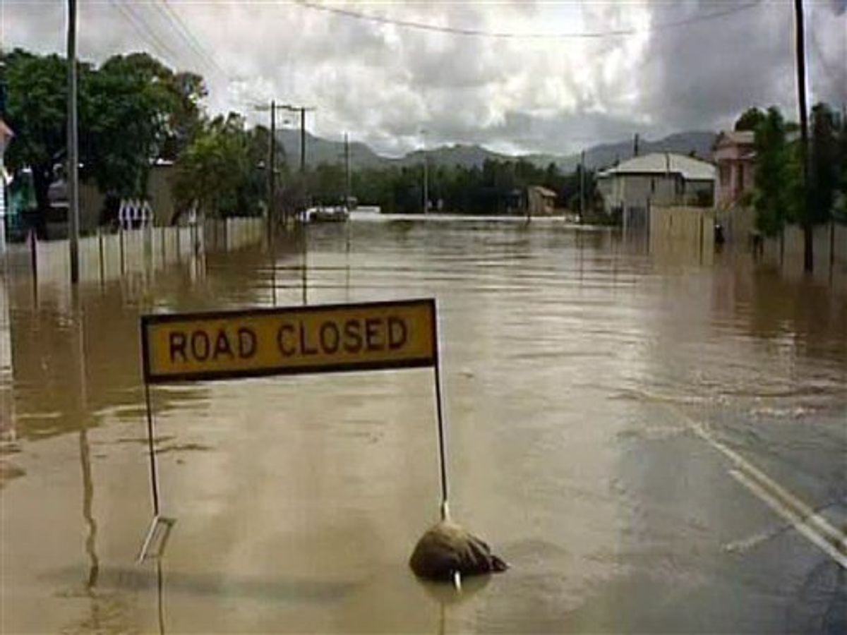 This image made from AuBC video via Associated Press Television News shows a flooded street in Rockhampton, Australia, Sunday, Jan. 2, 2011. Days of pounding rain last week left much of northeastern Australia swamped by a sea of muddy water, with flooding affecting about 200,000 people in an area larger than France and Germany combined. (AP Photo/AuBC via Associated Press Television News) AUSTRALIA OUT, TV OUT (AP)