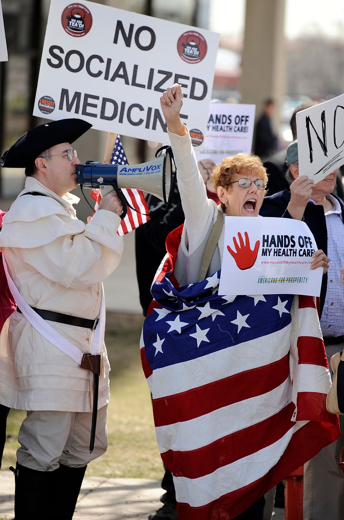 Rod Covenah, left, and Sally Sinacore, right, shout during a tea party protest against the proposed health care plan outside the office of Rep. Melissa Bean, D-Ill., in Schaumburg, Ill. on Tuesday, Mar. 16, 2010. (AP Photo/Paul Beaty) (Paul Beaty)