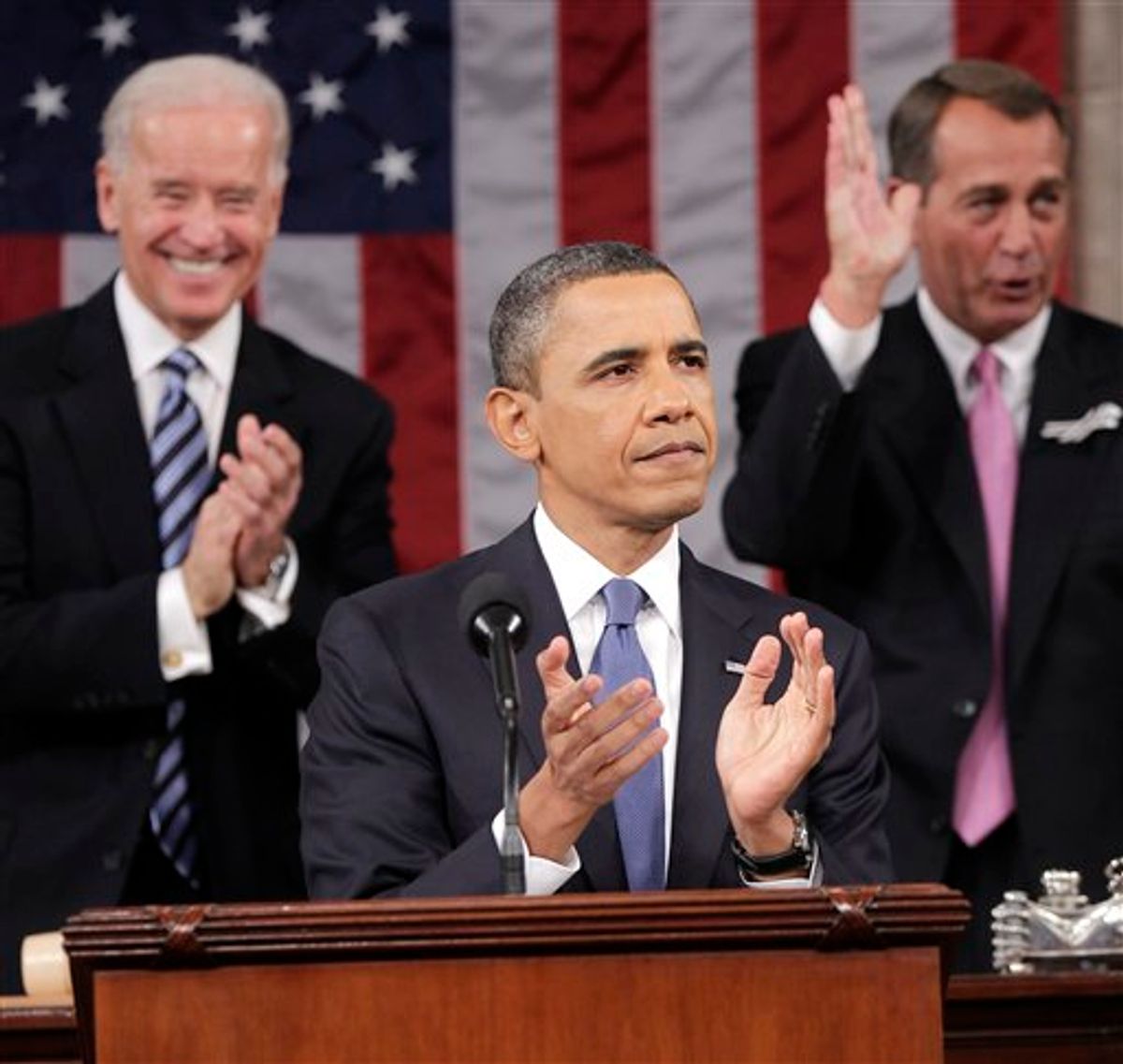 President Barack Obama is applauded by Vice President Joe Biden and House Speaker John Boehner of Ohio, prior to delivering his State of the Union address on Capitol Hill in Washington, Tuesday, Jan. 25, 2011.  (AP Photo/Pablo Martinez Monsivais, Pool) (AP)