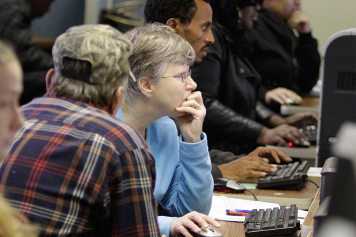 Unemployed workers use computers to search for jobs at the Virginia Employment Commission's Reemploy Virginia office in Mechanicsville, Va. 