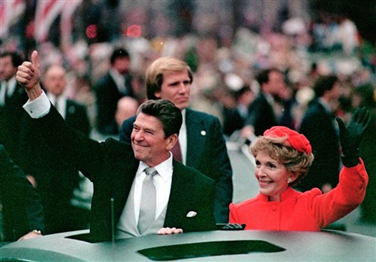 FILE- This Jan. 20, 1981 file photo, shows President Ronald Reagan as he gives a thumbs up to the crowd while his wife, first lady Nancy Reagan, waves from a limousine during the inaugural parade in Washington following Reagan's swearing in as the 40th president of the United States. Sunday, Feb. 6, 2011, marks the centennial anniversary of Reagan's birth. (AP Photo/File) (AP)