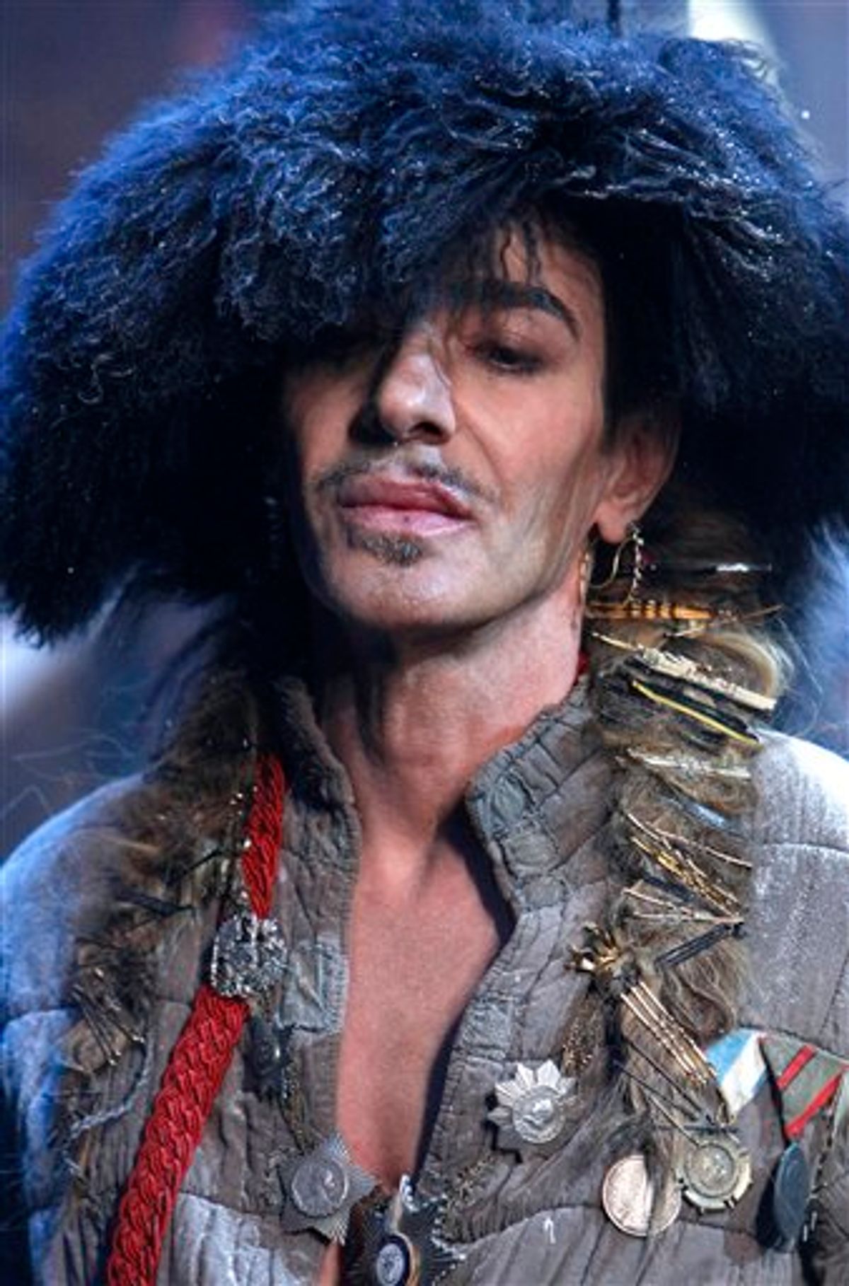 FILE - In this Jan. 21, 2011 file photo, British fashion designer John Galliano appears at the end of his men's fall-winter 2011/2012 fashion collection presented in Paris. Officials say Dior designer John Galliano was briefly detained after a spat in a Paris restaurant. An official with the Paris prosecutor's office says a couple in the restaurant accused Galliano of making anti-Semitic insults. A police official said Friday, Feb. 25, 2011 that Galliano also exchanged slaps with the couple. (AP Photo/Jacques Brinon, File)   (AP)
