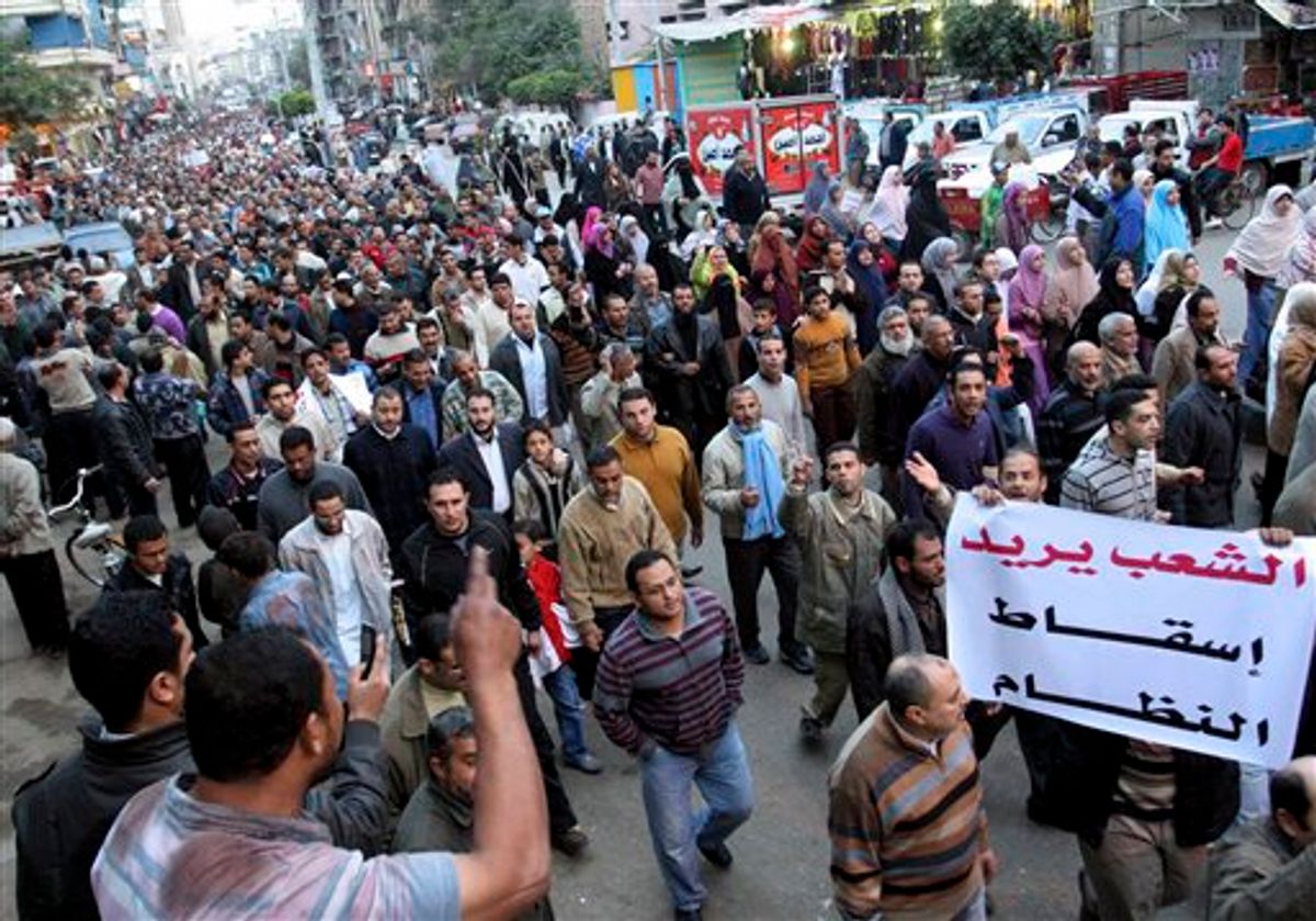 Egyptian anti-Mubarak protesters march in al Mansoura city, Egypt, Sunday, Feb. 6, 2011.  Egypt's largest opposition group, the Muslim Brotherhood, said it would begin talks Sunday with the government to try to end the country's political crisis but made clear it would insist on the immediate ouster of longtime authoritarian President Hosni Mubarak. Arabic read " People Need the Removal of the Regime". (AP Photo) (AP)