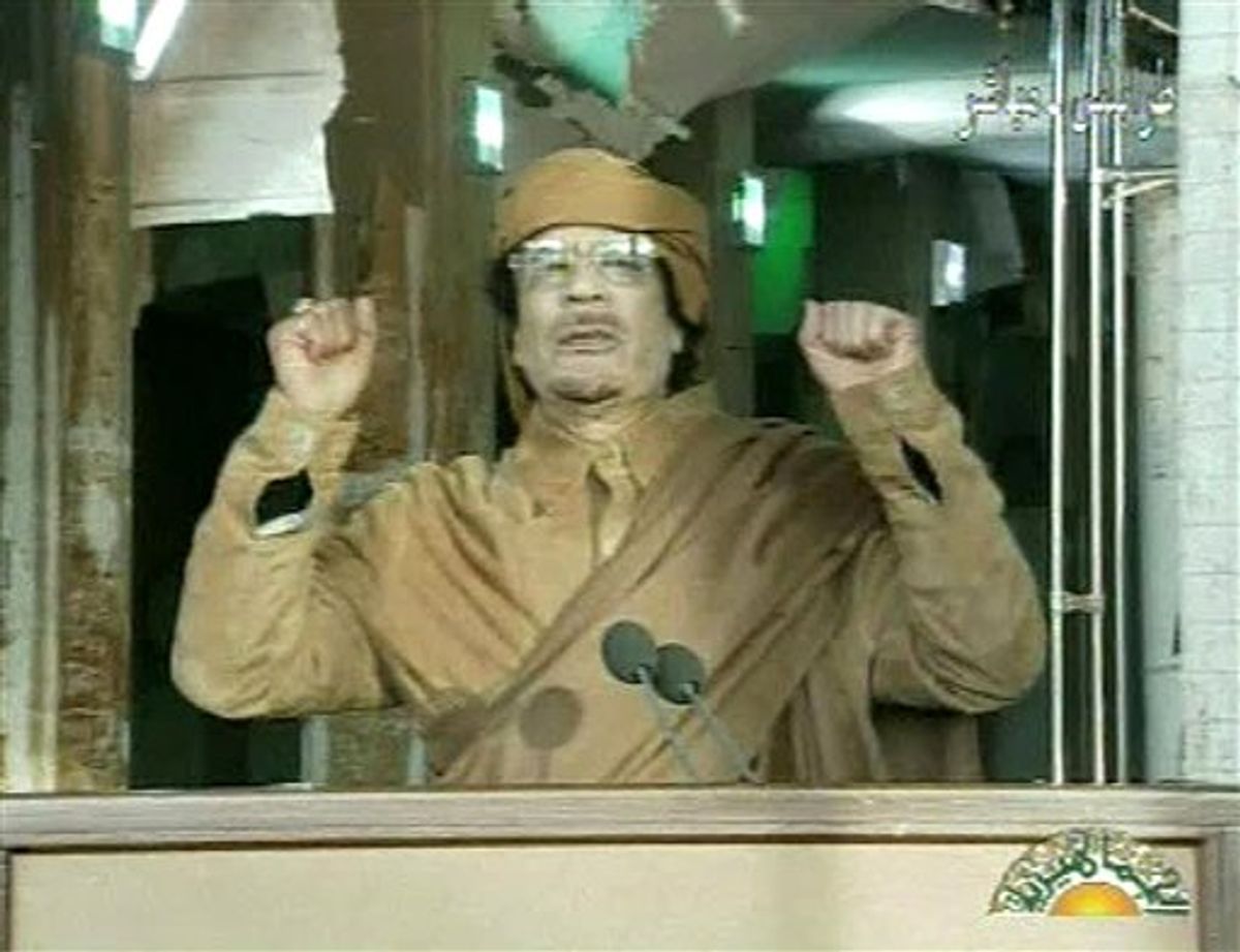 This image broadcast on Libyan state television Tuesday, Feb. 22, 2011, shows Libyan leader Moammar Gadhafi as he addresses the nation in Tripoli, Libya. Libya's Gadhafi vowed to fight on against protesters demanding his ouster and die as martyr. (AP Photo/Libya State Television via APTN) (AP)