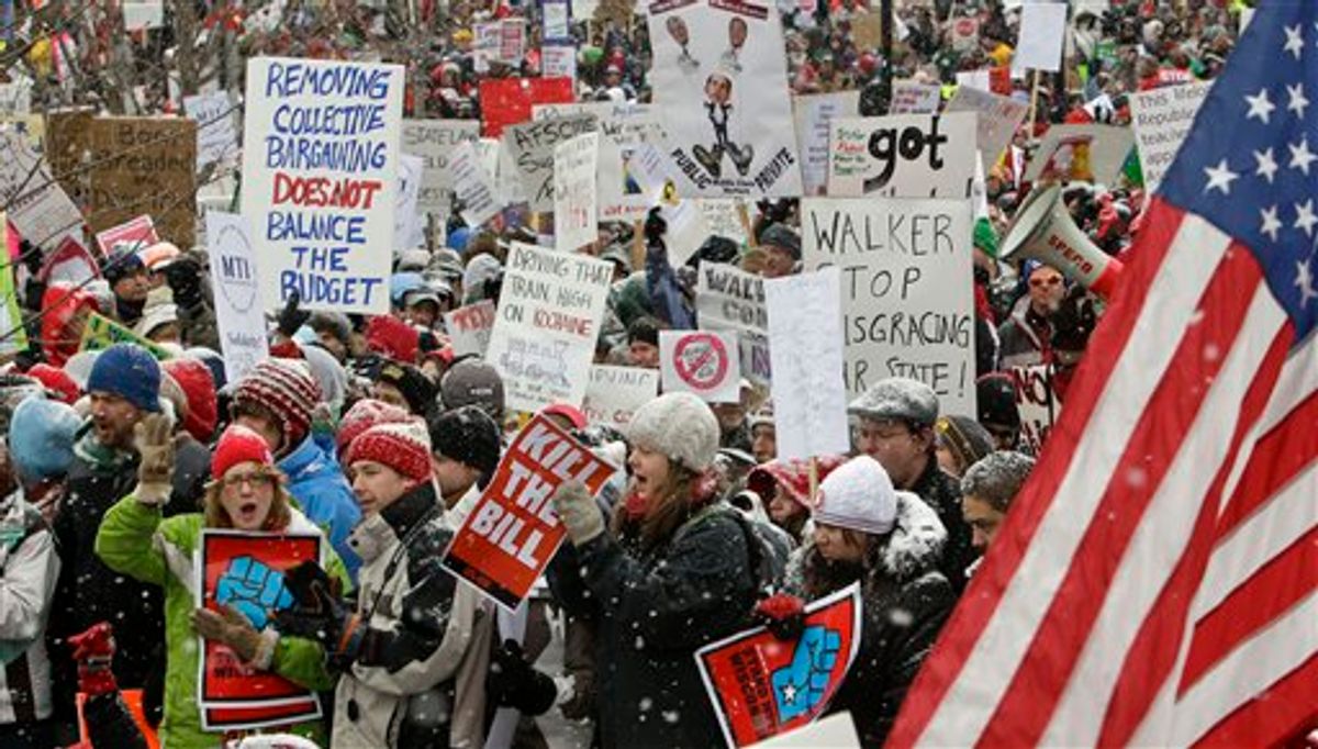 Opponents to the governor's bill to eliminate collective bargaining rights for many state workers protest outside of the state Capitol in Madison, Wis., Saturday, Feb. 26, 2011. Union supporters are on the 12th day of protests at the Capitol. (AP Photo/Andy Manis)    (AP)