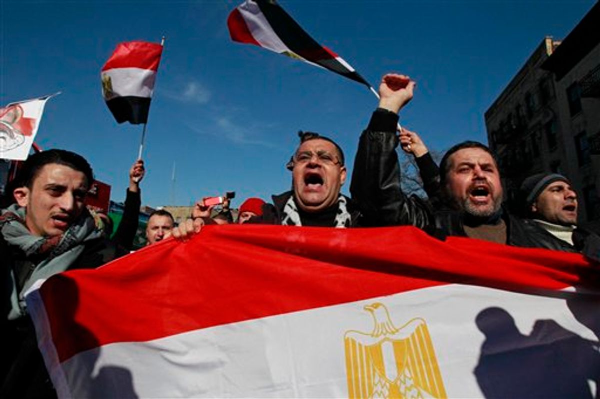 People celebrate after Egypt's President Hosni Mubarak resigned from office Friday, Feb. 11, 2011 in the Queens borough of New York. Mubarak resigned as president after 29 years in power. (AP Photo/Frank Franklin II) (AP)