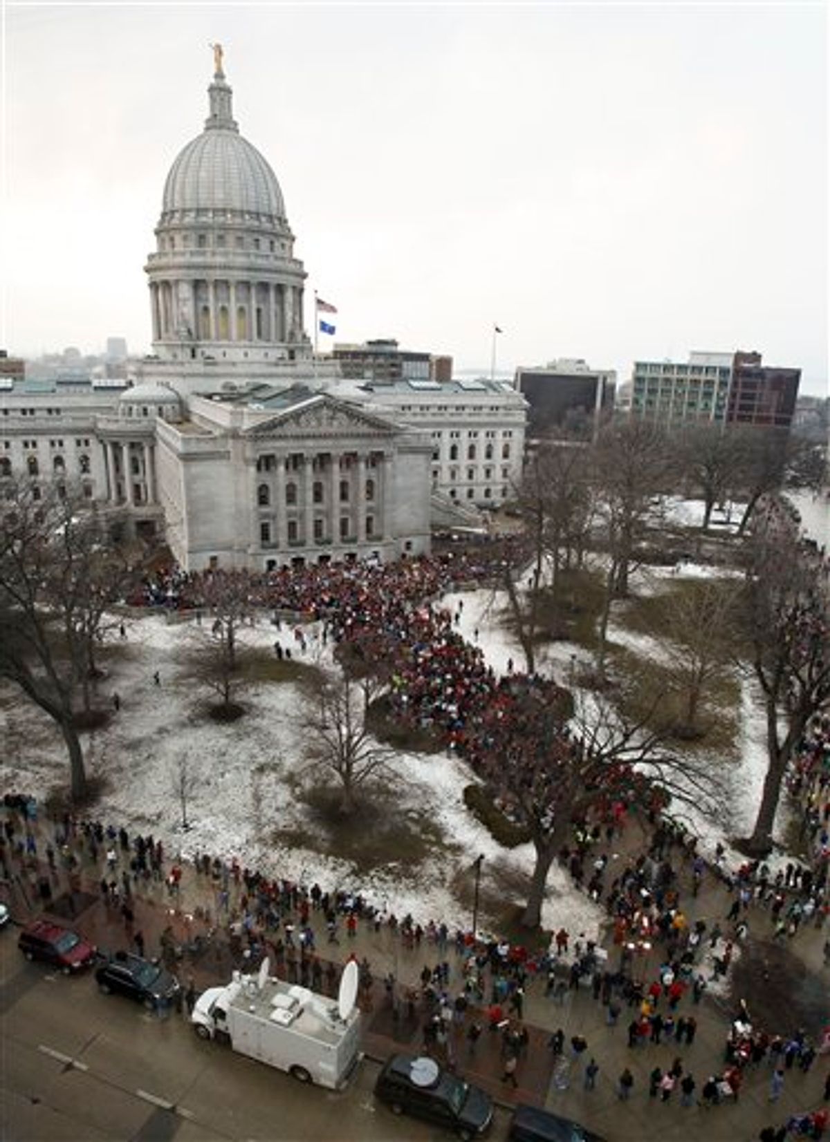 Protestors gather outside of the State Capitol in Madison, Wis., to voice their opposition to Wisconsin Gov. Scott Walker's bill to eliminate collective bargaining rights for many state workers. (AP Photo/Andy Manis) (AP)